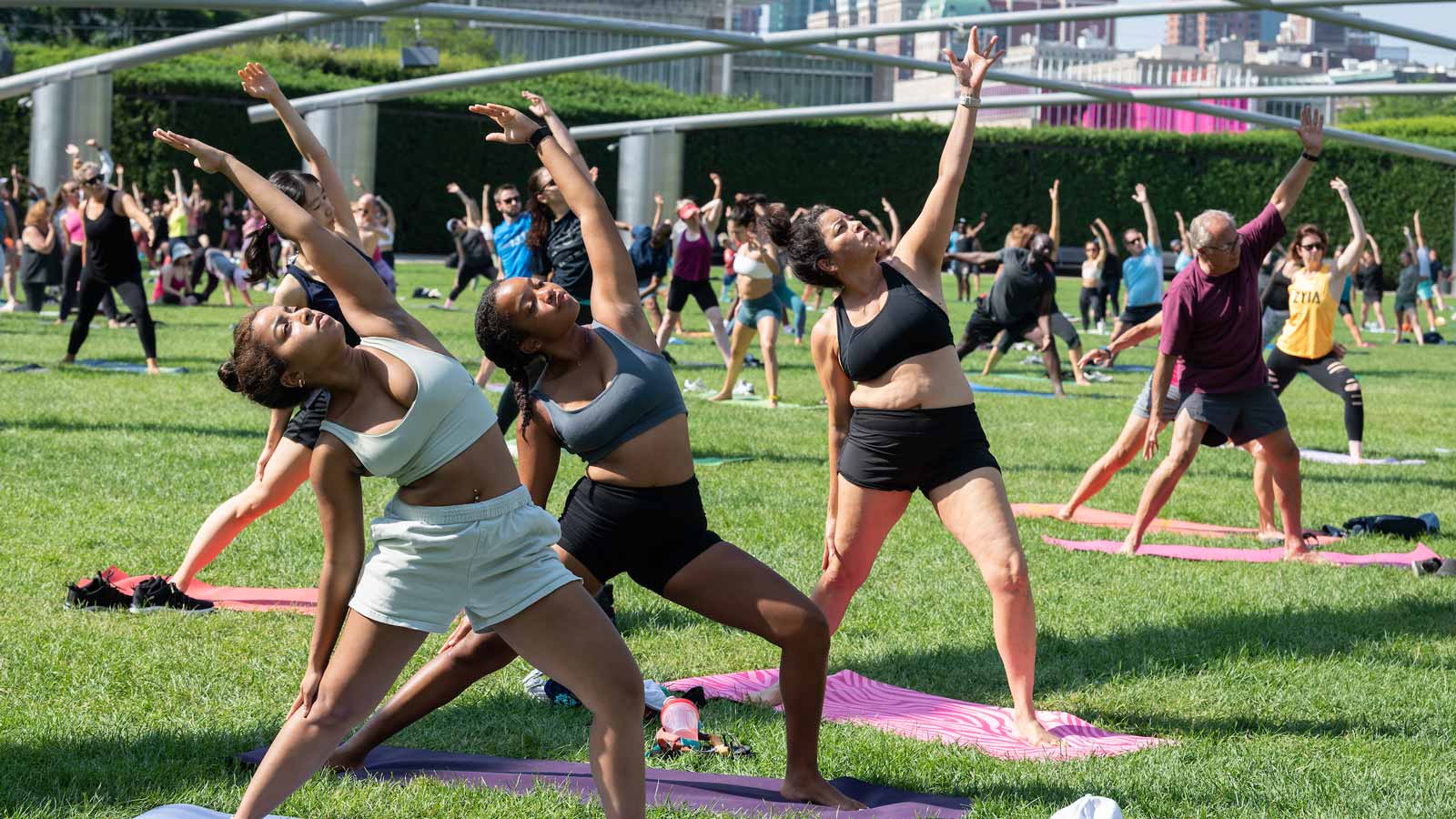 People attending a yoga workout in Millennium Park