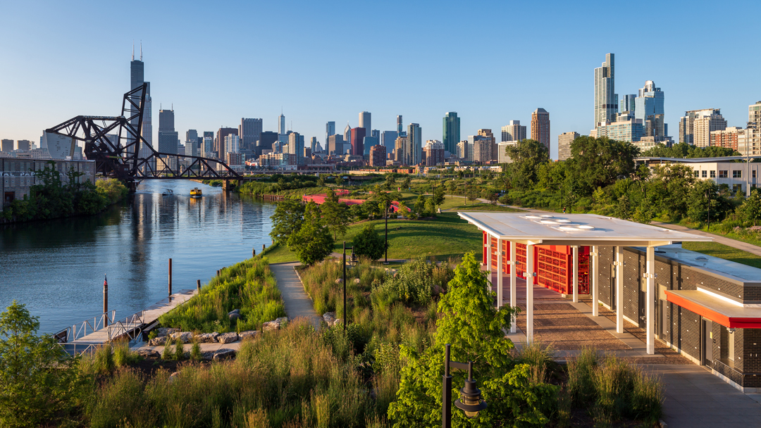 Image of Ping Tom Park next to the Chicago River with the skyline in the background