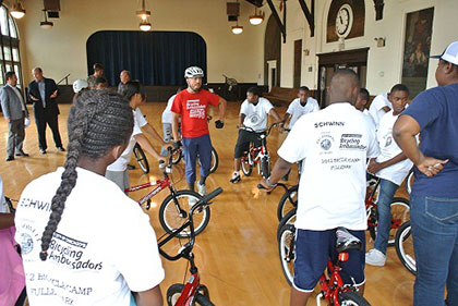 Kids learning from the Chicago Bicycling Ambassadors about bike safety