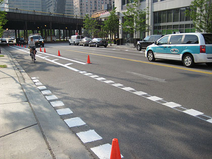 crews install Kinzie bike lane