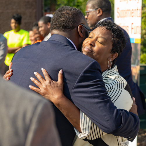 Intro Pic - Victims and Survivors Mayor Brandon Johnson embrace