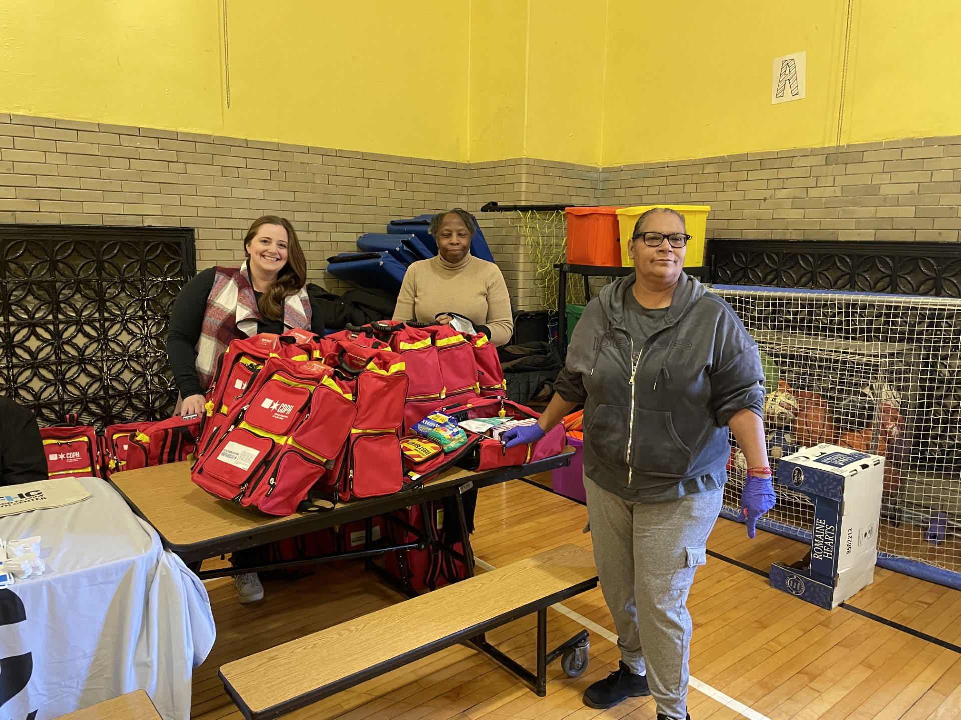 MRC Volunteers packing emergency kits with supplies