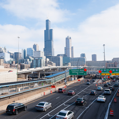 Chicago skyline and traffic UIC Halsted blue line station CTA Chicago Transit Authority Eisenhower Expressway interstate highway I-290 construction skyline loop buildings winter