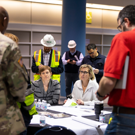 CDPH Intro Pic - Public Health Emergency Local and federal agencies meet and walk through McCormick Place to prepare for the construction of an alternate care facility in response to the COVID-19 pandemic; March 2020.