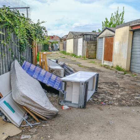 CDPH Intro Pic - Fly Dumping Large pile of rubbish, rotting after being fly tipped and left in an urban alleyway. Demonstrates anti-social behaviour.