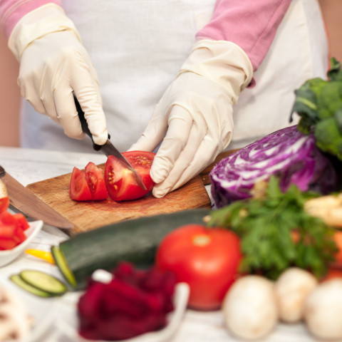 Intro Pic - Food Service Sanitation Certificates food preparation - cutting tomato on wood cutting boare