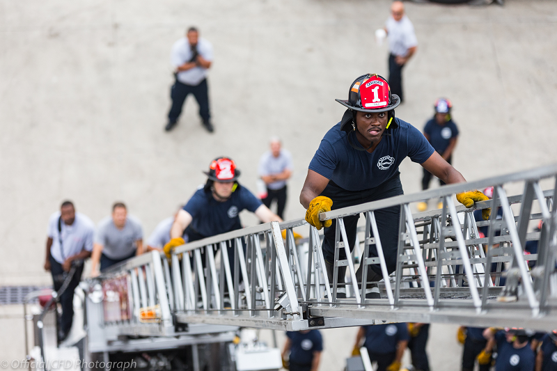 Candidates climbing ladder in training