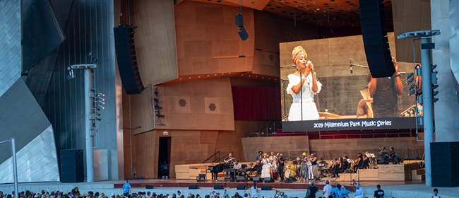 Crowd enjoying a performance at the Jay Pritzker Pavilion in Millennium Park