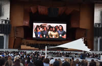 Crowd watching a movie at Pritzker Pavilion Stage in Millennium Park