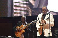 Jazz performers performing onstage at the Pritzker Pavilion Stage in Millennium Park