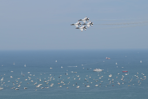 Chicago Air and Water Show (Thunderbirds flying over boats sailing in Lake Michigan with a blue sky in the background)