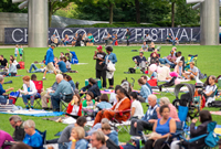 Plan Your Visit (Crowd sitting on the Great Lawn in Millennium Park during the Chicago Jazz Festival)