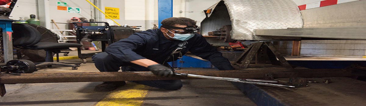 Tradesman working on city vehicle