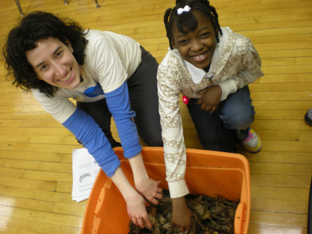 C3 Explorer volunteer interacts with a C3 Student Club member at a community event