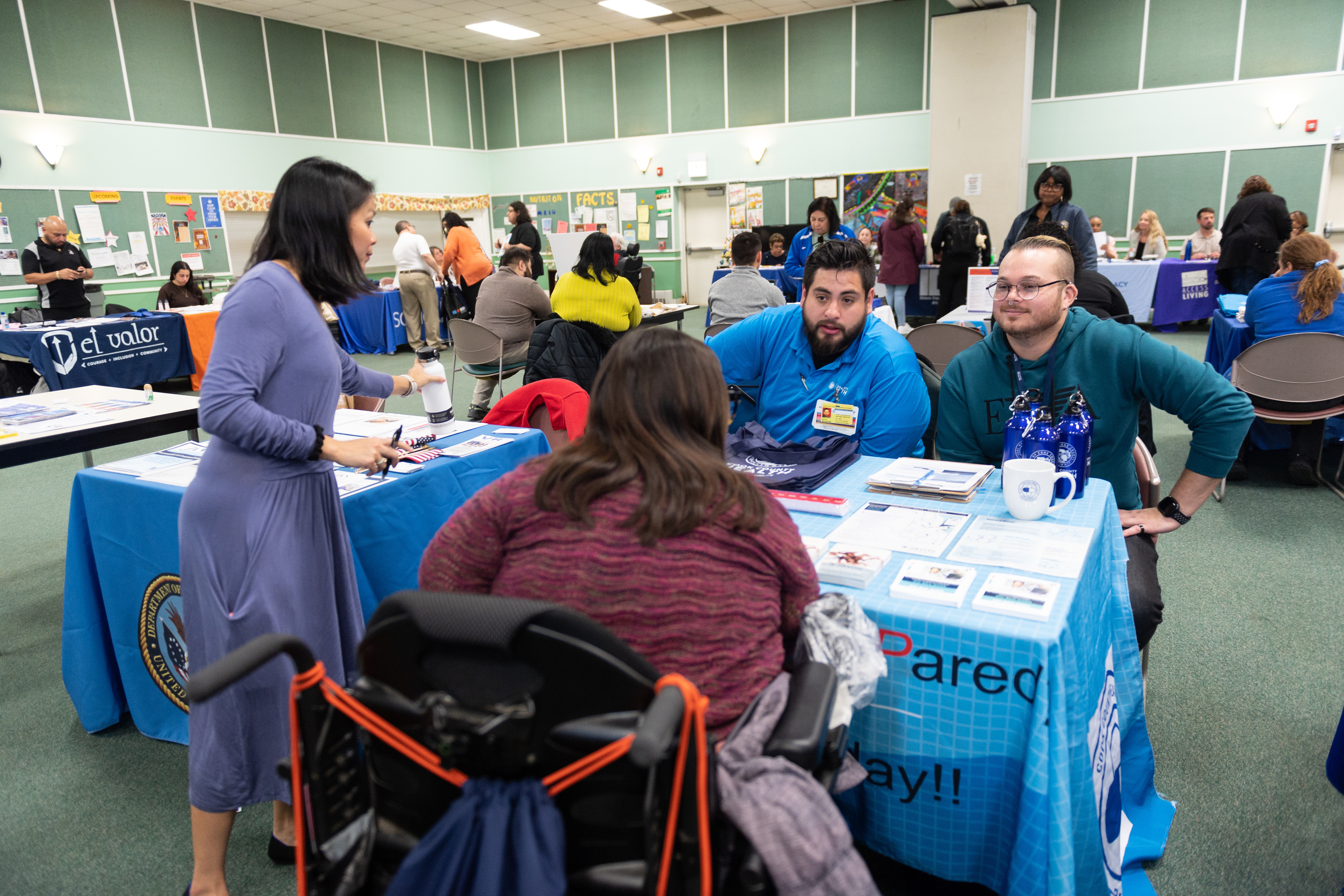 Partners answer questions at the 2023 MOPD Resource Fair, held in November at Central West Community Center.