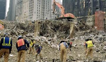 Recover - Image of the site of a disaster, and a cleanup crew