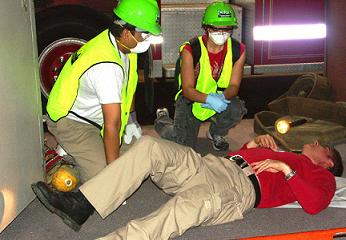 Respond - group of emergency workers helping an injured person