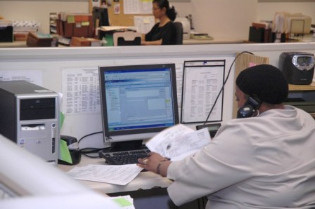 Employee working at a computer.