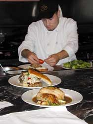 A chef in a restaurant A chef in a restaurant