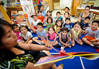 A female teacher teaching a class