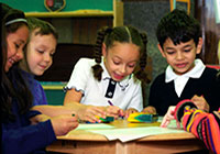 Young children coloring in a book