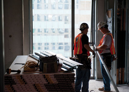 photo of 2 workers in a construction building project photo of 2 workers in a construction building project