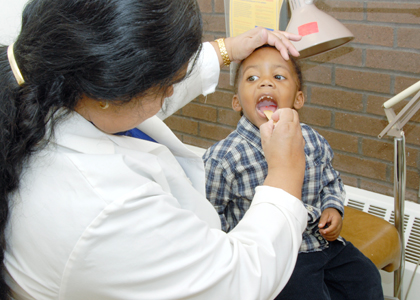 Healthcare Professional examining a child