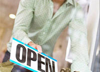 A Person Holding an Open Sign