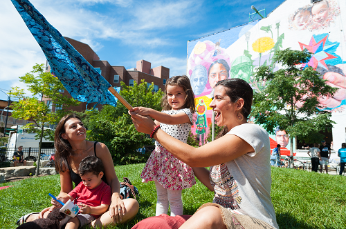 two women in a park with kids