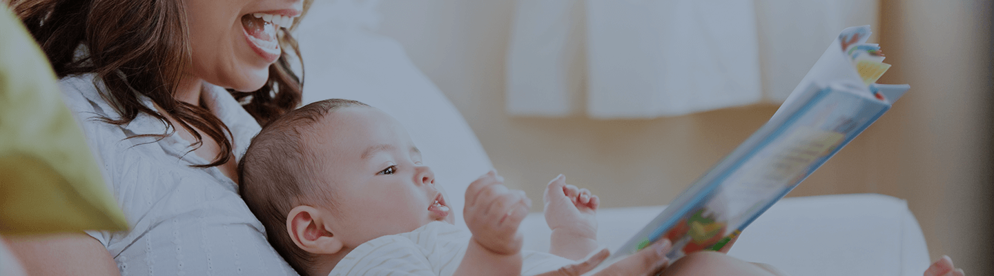Baby Development banner mother and baby reading from a storybook