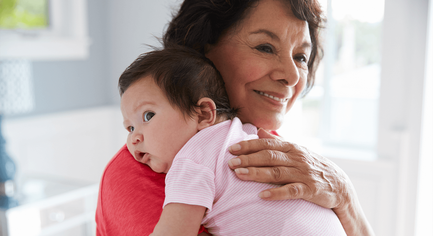 Older woman holding infant