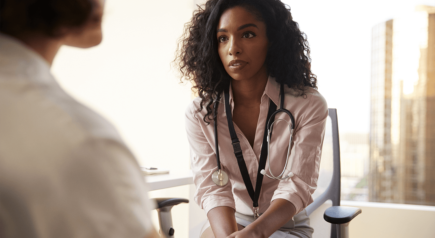 Female doctor consulting with patient