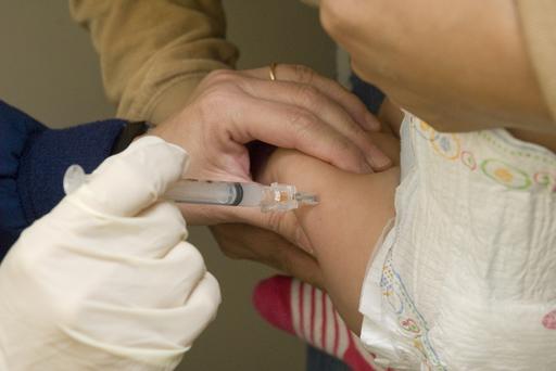 Infant being immunized