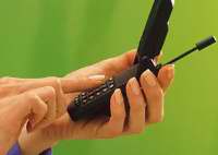 Image of a person calling in an environmental complaint using their cell phone